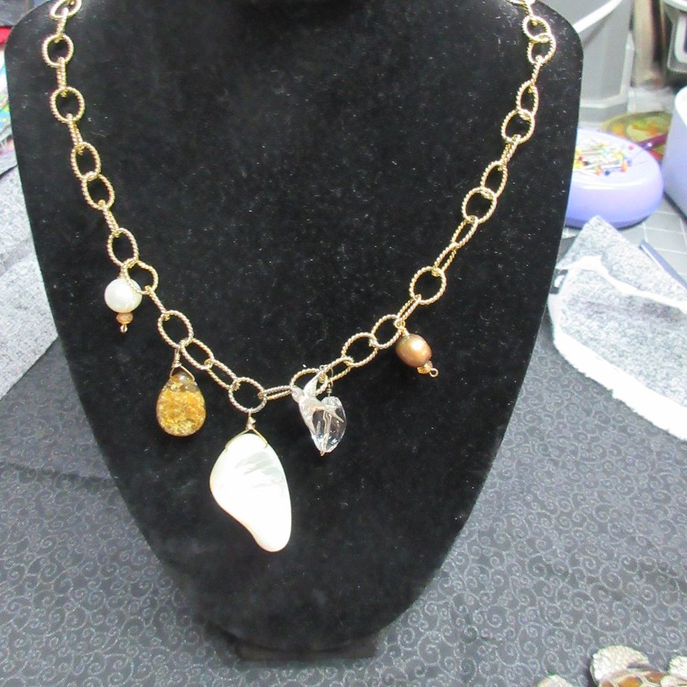 Necklace - 20 inch long open gold toned link necklace with pearls and shells